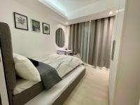 High-end 2BR Condo Boracay Tower - Azure Residences near Manila Airportにあるベッド