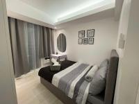 High-end 2BR Condo Boracay Tower - Azure Residences near Manila Airportにあるベッド