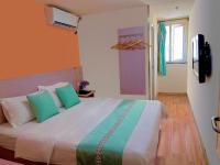 M Hotel Xiamen Haicang Maqing Road Metro Stationにあるベッド