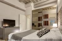 A bed or beds in a room at Belle Donne Apartments by Mamo Florence
