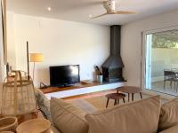 A television and/or entertainment centre at LLEBEIG -Casa mediterránea con gran jardín