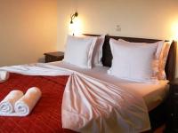 Postel nebo postele na pokoji v ubytování Zagori Philoxenia Hotel