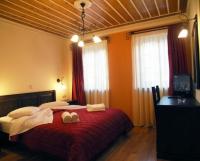 Postel nebo postele na pokoji v ubytování Zagori Philoxenia Hotel