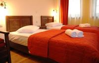 Postel nebo postele na pokoji v ubytování Zagori Philoxenia Hotel