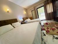 Postel nebo postele na pokoji v ubytování Savor Star pyramids hotel