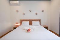 Urbanview Villa Pondok Uma Sari near Ubudにあるベッド