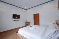 Urbanview Villa Pondok Uma Sari near Ubudにあるベッド