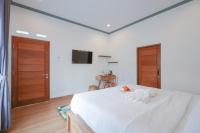 Urbanview Villa Pondok Uma Sari near Ubudにあるベッド