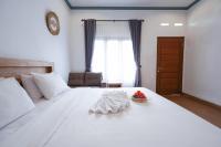 Urbanview Villa Pondok Uma Sari near Ubudにあるベッド