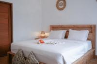 Urbanview Villa Pondok Uma Sari near Ubudにあるベッド