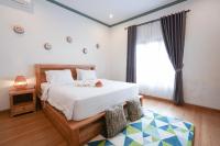 Urbanview Villa Pondok Uma Sari near Ubudにあるベッド