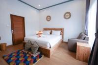 Urbanview Villa Pondok Uma Sari near Ubudにあるベッド