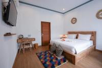 Urbanview Villa Pondok Uma Sari near Ubudにあるベッド