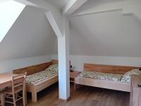 Postel nebo postele na pokoji v ubytování Apartmány u lesa