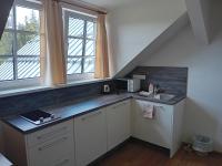 Kuchyň nebo kuchyňský kout v ubytování Apartmány u lesa