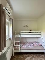 Posteľ alebo postele v izbe v ubytovaní Apartman Ferenac