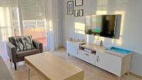 Televízia a/alebo spoločenská miestnosť v ubytovaní Sunset Victoria Beach