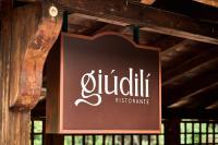 Un cartel de un restaurante colgado en una pared. en Hotel Camigliatello, en Camigliatello Silano