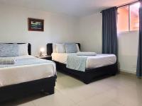 Postel nebo postele na pokoji v ubytování Hotel Olimpo