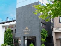 a building with a sign on the front of it at APA Hotel Karuizawa Ekimae Karuizawaso in Karuizawa