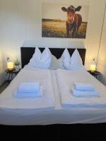 Łóżko lub łóżka w pokoju w obiekcie Ferienwohnung 5