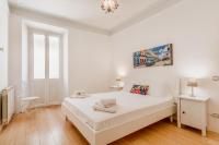 Posteľ alebo postele v izbe v ubytovaní BBHOME Comfort apartment near Colosseum