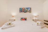 Posteľ alebo postele v izbe v ubytovaní BBHOME Comfort apartment near Colosseum