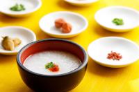 a bowl of soup on a table with other dishes at Saito Hotel in Ueda