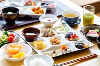 a tray of food on a table with plates of food at Saito Hotel in Ueda