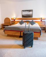 Posteľ alebo postele v izbe v ubytovaní Hotel Horizont