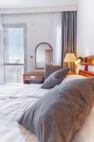 Posteľ alebo postele v izbe v ubytovaní Hotel Horizont