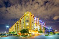 a large yellow building with colorful lights on it at Bluegreen Vacations Club 36, an Ascend Collection Resort in Las Vegas