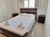 Postel nebo postele na pokoji v ubytování City Sunshine, Strovolos - Nicosia