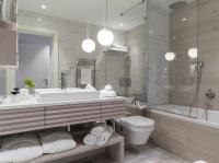 a bathroom with a sink and a tub and a toilet at Hotel Bellevue Dubrovnik in Dubrovnik