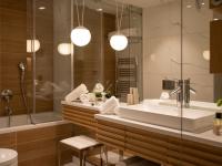 a bathroom with a sink and a shower and a tub at Hotel Bellevue Dubrovnik in Dubrovnik