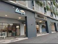 a building with a sign on the side of it at 4 Bedrooms VivaVibes Home at Ostia Bangi next to Bangi Toll in Bandar Baru Bangi