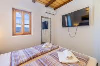 Posteľ alebo postele v izbe v ubytovaní Holiday house Villa Šilo