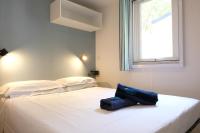 Posteľ alebo postele v izbe v ubytovaní Happy Camp mobile homes in Porto Cesareo Camping