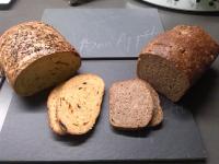 three loaves of bread sitting on a cutting board at B&amp;B Molmento in Mol