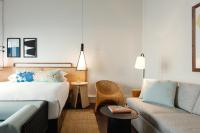 a hotel room with a bed and a couch at Ridley House - Key West Historic Inns in Key West