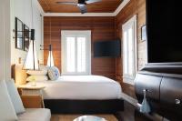 a bedroom with a bed and a ceiling fan at Ridley House - Key West Historic Inns in Key West