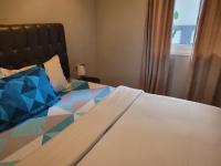 9 Residences Seminyakにあるベッド