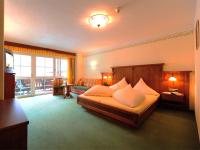 Postel nebo postele na pokoji v ubytování Hotel Dorfstadl