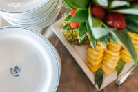 a plate of food with fruit on a table at Rouge Hotel International in Milano Marittima