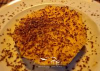 a white plate with a piece of food on it at Refúgio dos Capelinhos - Villa e Suites in Norte Pequeno