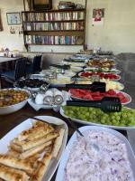 a table topped with lots of different types of food at Kemal's Guest House in Goreme