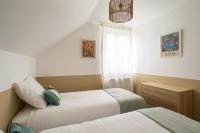Łóżko lub łóżka w pokoju w obiekcie Terra Lodge - maison avec piscine proche plages