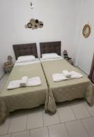A bed or beds in a room at Dionysus House Lasithi Plateau