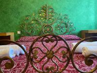 A bed or beds in a room at VILLA GHIANDARE