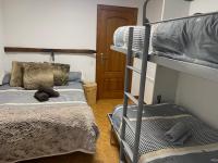 A bed or beds in a room at DÚPLEX La MOLINA a 5 minutos de las pistas de esquí